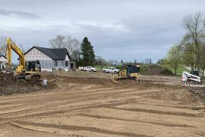 Grading outside a residential home.